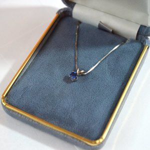 Sapphire solitaire necklace, white gold setting. 5" round, high quality stone.